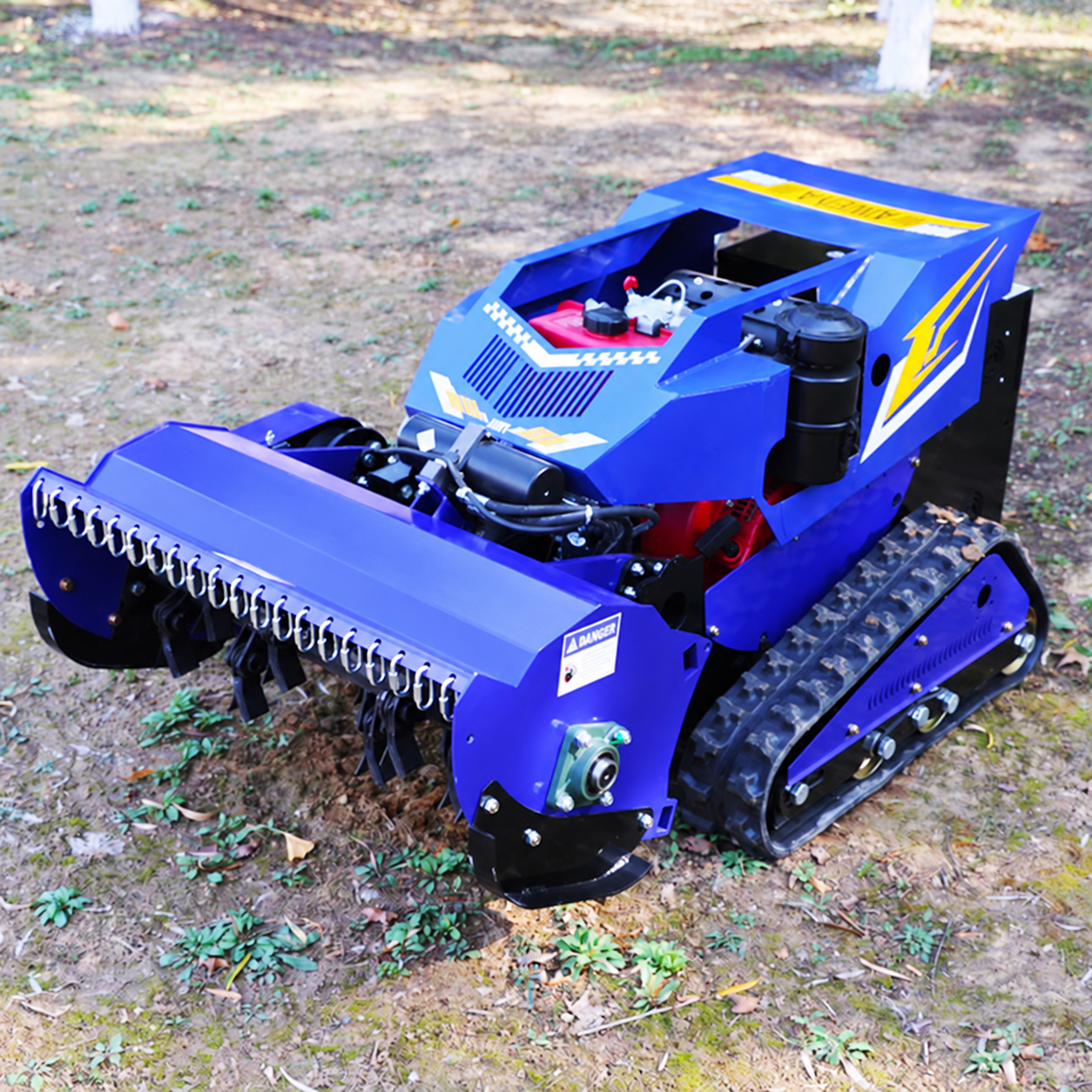 Remote flail mower cutting rough vegetation